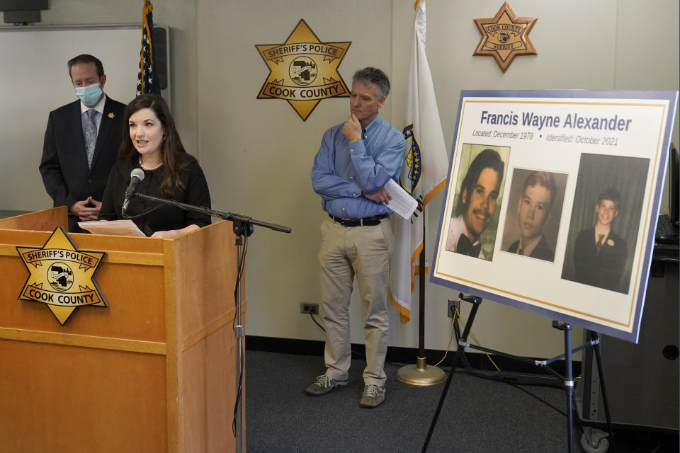 Cairenn Fullam-Binder, center, with the nonprofit organization called the DNA Doe Project, talks about the group's involvement in helping authorities identify "Gacy Victim 5" as North Carolina native Francis Wayne Alexander, during a news conference Monday, Oct. 25, 2021, in Maywood, Ill. Joining Fullam-Binder are Cook County Sheriff's Detective Lt. Jason Moran, left, and and Sheriff Tom Dart. (AP Photo/Charles Rex Arbogast)