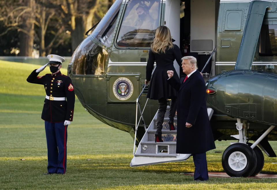 President Donald Trump and first lady Melania Trump board Marine One on the South Lawn of the White House, Wednesday, Dec. 23, 2020, in Washington. (AP Photo/Evan Vucci)