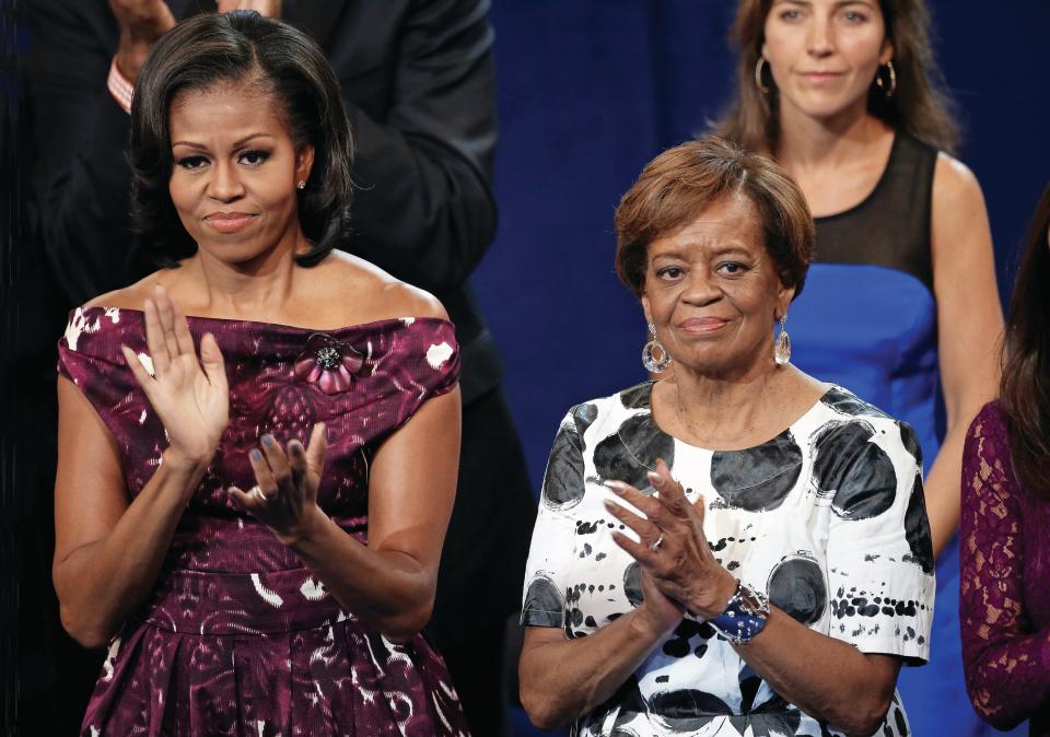 Former first lady Michelle Obama applauds with her mother, Marian Robinson, at the Democratic National Convention on Sept. 6, 2012, in Charlotte, N.C.