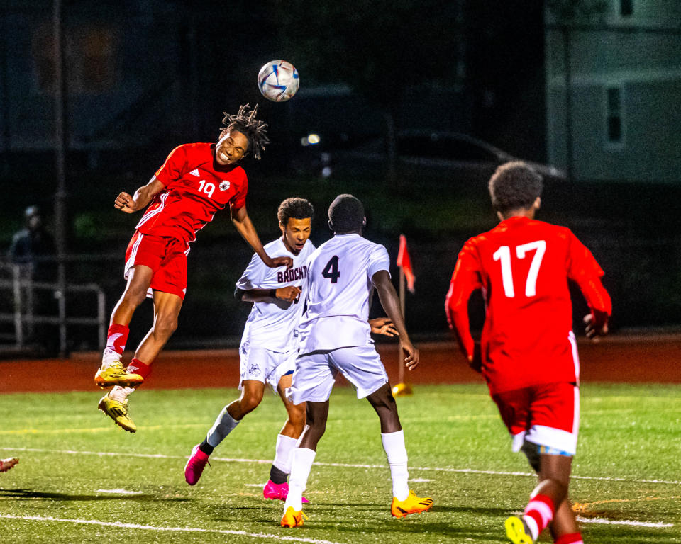 New Bedford's Nicolas Rossa heads the ball towards goal.