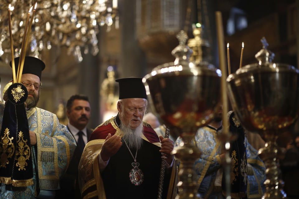 <p>Ecumenical Patriarch Bartholomew I, the spiritual leader of the world’s Orthodox Christians, center, conducts a mass at the Patriarchate’s church prior to the traditional throwing of a wooden cross into the waters during the Epiphany ceremony to bless the waters at the Golden Horn in Istanbul, Saturday, Jan. 6, 2018. (Photo: Emrah Gurel/AP) </p>