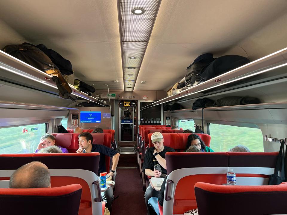 interior shot of a eurostar train carriage with passengers in the seats