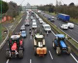 <p>Farmers from the FDSEA union drive their tractors slowly dow Toulouse ring road during a go-slow operation on Jan. 31, 2018. The operation was in protest against the future single-use land zoning, they fear may reduce the number of municipalities eligible for certain European aid. Photo from Pascal Pavani/AFP/Getty Images. </p>