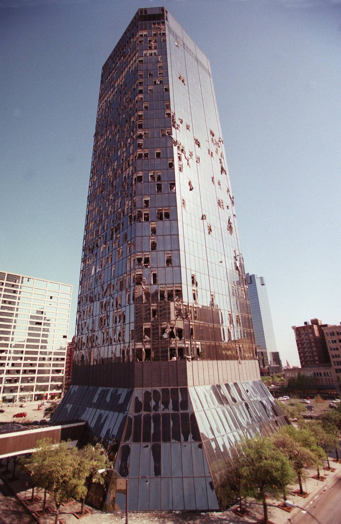The Bank One tower shows damage the day after a tornado hit Fort Worth on March 28, 2000. Years later, the restored building would become The Tower condominiums.