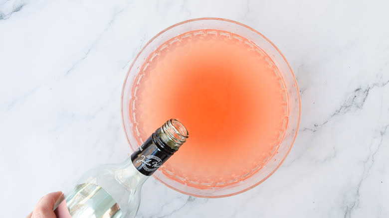 Adding rosé wine to punch bowl