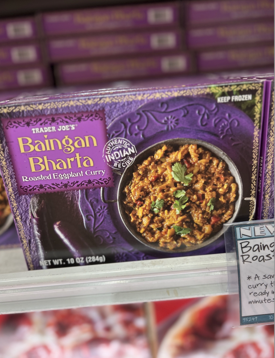 Trader Joe's Baingan Bharta frozen meal packaging on a grocery store shelf