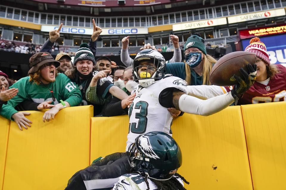 Philadelphia Eagles safety Rodney McLeod (23) celebrates with fans after making an interception against Washington Football Team quarterback Taylor Heinicke (4) in the final minute the second half of an NFL football game, Sunday, Jan. 2, 2022, in Landover, Md. Philadelphia won 20-16. (AP Photo/Alex Brandon)