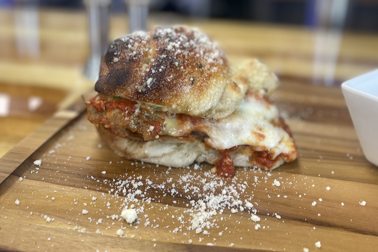 A new restaurant's menu features authentic Italian dishes and unique creations, including a giant garlic knot sandwich.