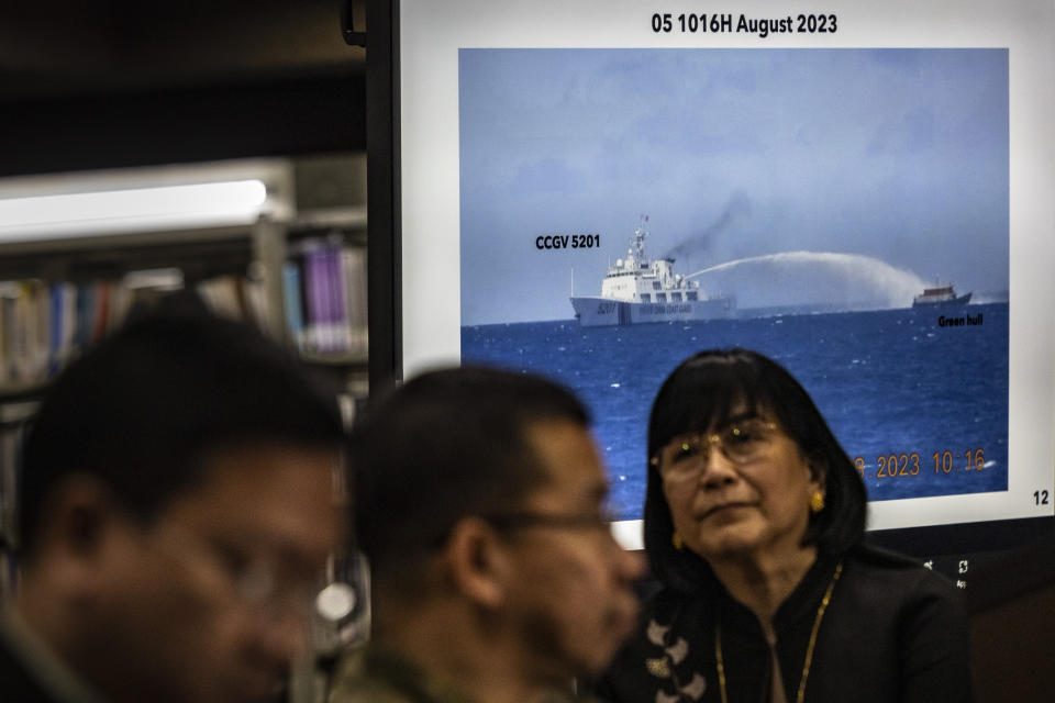Footage of a Chinese Coast Guard ship using a water cannon against a Filipino resupply vessel is shown during a press conference at the Philippine Department of Foreign Affairs in Manila, Philippines on Monday, Aug. 7, 2023. The Philippine government summoned the Chinese ambassador on Monday to convey a diplomatic protest over the Chinese coast guard's use of a water cannon against a Filipino supply boat in the disputed South China Sea, a Philippine official said. (Ezra Acayan/Pool Photo via AP)