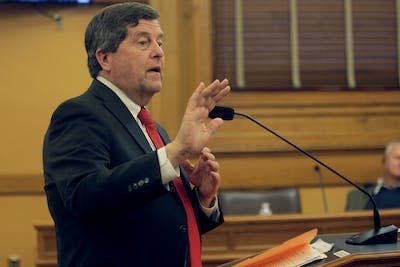 The head of the Kansas Public Employees Retirement System testifies before a Kansas legislative committee in March 2023 about a bill that would bar the pension system from ESG investing. (AP Photo/John Hanna)