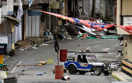 A view of the Maute group stronghold with an ISIS flag in Marawi City in southern Philippines May 29, 2017. REUTERS/Erik De Castro