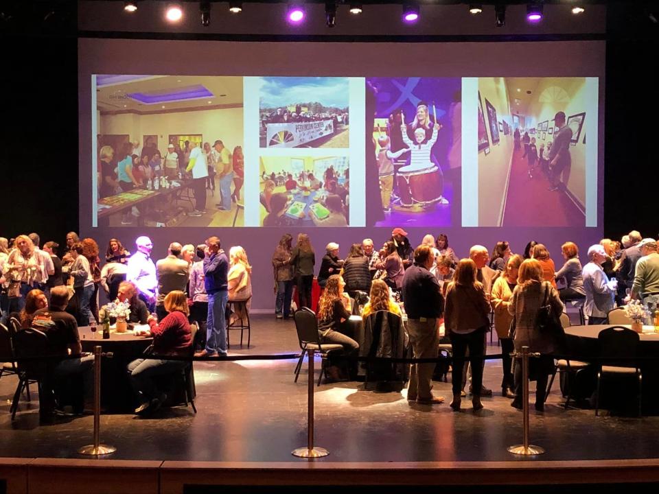 Kiwanis Club of Chester Wine Tasting Festival attendees sip, savor and mingle on the 35’ x 36’ stage in the Jimmy Dean Theater at the Perkinson Center for the Arts and Education in Chester on March 18, 2023.