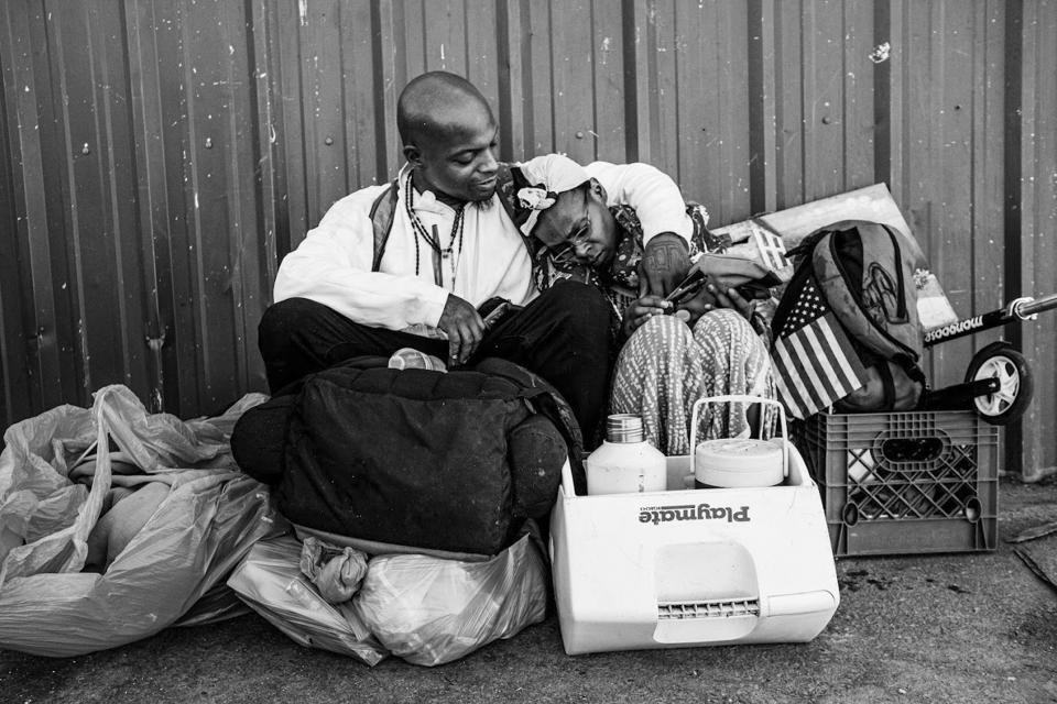 In this undated photo provided by Eric Elmore, a homeless man poses for a photograph in Phoenix. Elmore documented Phoenix’s homeless people in addition to Roosevelt White III, who was 36 when he died of a stroke in September after falling ill in the Phoenix homeless encampment known as “The Zone.” Roosevelt is among thousands of homeless people who died this year and are being remembered at winter solstice events for Homeless Persons’ Memorial Day. (Eric Elmore via AP)