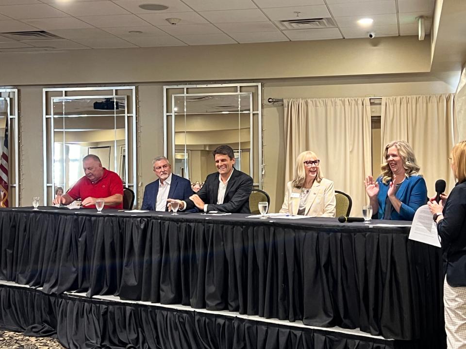 Candidates for two Sarasota School Board seats in August's election sit at a public forum at South County Tiger Bay on Friday, July 26, 2024.