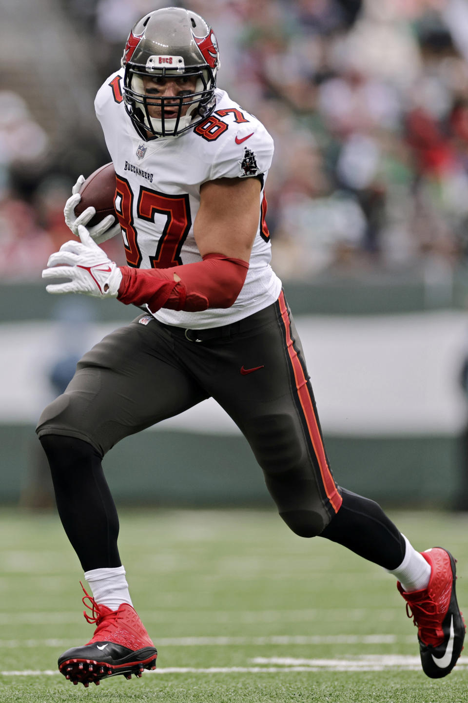 FILE - Tampa Bay Buccaneers tight end Rob Gronkowski (87) runs with the ball during an NFL football game against the New York Jets, Sunday, Jan. 2, 2022, in East Rutherford, N.J. Four-time All-Pro tight end Rob Gronkowski announced his retirement again, Tuesday, June 21, 2022. (AP Photo/Adam Hunger)