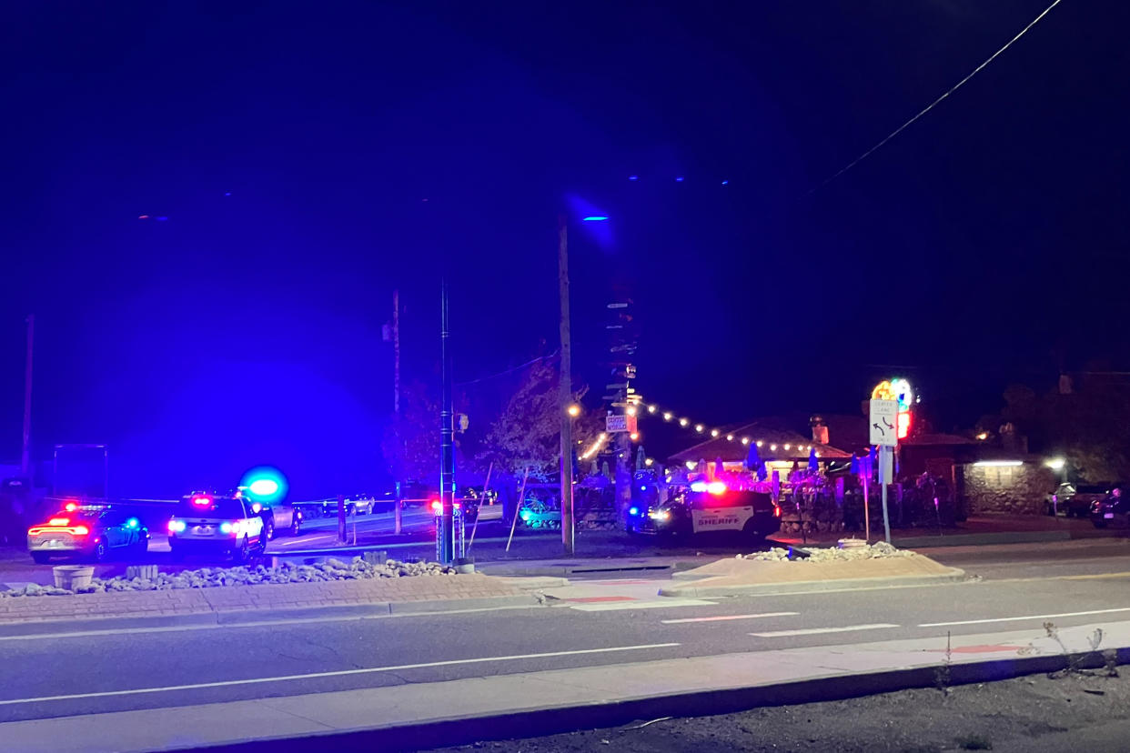 This early Sunday, Oct. 9, 2022, photo provided by the Jefferson County Sheriff's Office shows the scene of a fatal vehicle attack in Golden, Colo. Colorado authorities say a man drove a pickup truck through a crowd following an altercation outside a bar. (Jenny Fulton/Jefferson County Sheriff's Office via AP)