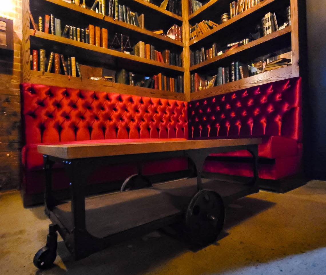 The first room inside Gatsby is a small library. To get inside the speakeasy, a book on a shelf triggers a hidden door.