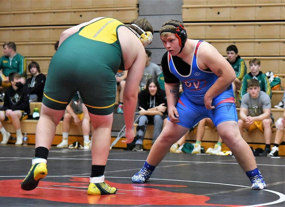 Junior Logan McGraw (285) sizes up his opponent at the beginning of the match. McGraw finished his day undefeated with five win and zero losses.