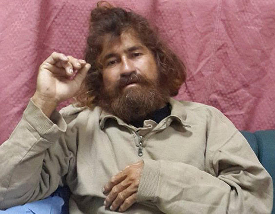 In this Monday, Feb. 3, 2014 photo provided by the Marshall Islands Foreign Affairs Department, a man identifying himself as 37-year-old Jose Salvador Alvarenga sits on a couch in Majuro in the Marshall Islands, after he was rescued from being washed ashore on the tiny atoll of Ebon in the Pacific Ocean. Alvarenga told the U.S. ambassador in the Marshall Islands Tom Armbruster and the nation's officials that he left Mexico in December 2012 for a day of shark fishing and ended up surviving 13 months on fish, birds and turtles before washing ashore on the remote Marshall Islands thousands of miles (kilometers) away. (AP Photo/Foreign Affairs Department The Marshall Islands, Gee Bing)