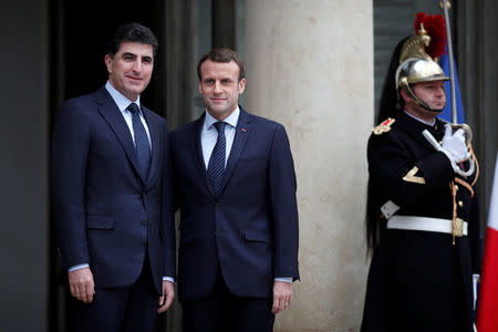 French President Emmanuel Macron welcomes Kurdish region's Prime Minister Nechirvan Barzani at the Elysee Palace in Paris, France, December 2, 2017. REUTERS/Benoit Tessier