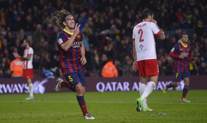 FC Barcelona's Carles Puyol reacts after scoring against Almeria during a Spanish La Liga soccer match at the Camp Nou stadium in Barcelona, Spain, Sunday, March 2, 2014. (AP Photo/Manu Fernandez)