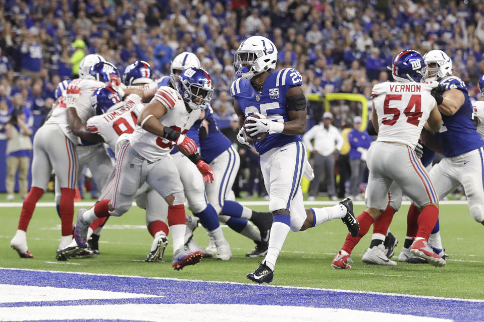 Indianapolis Colts running back Marlon Mack (25) runs in for a touchdown against the New York Giants during the second half of an NFL football game in Indianapolis, Sunday, Dec. 23, 2018. (AP Photo/Darron Cummings)