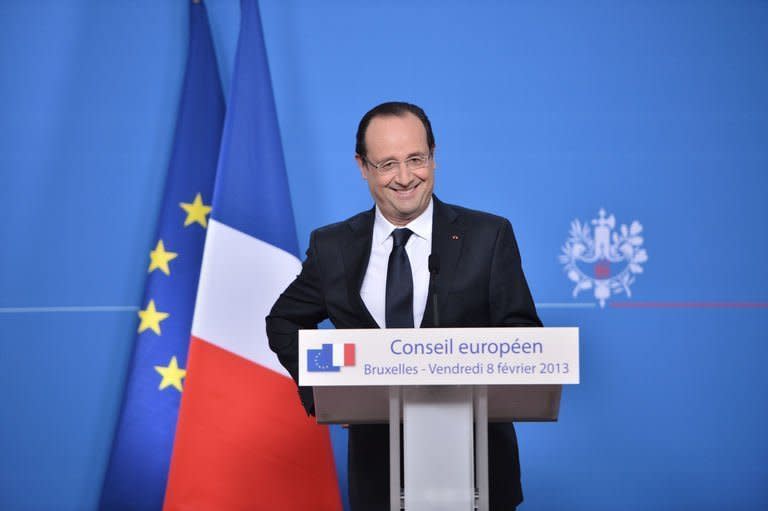 French President Francois Hollande attends a press conference at EU headquarters in Brussels, on February 8, 2013. European Union leaders agreed the first ever cut in the bloc's budget after all-night talks driven by sharp differences over priorities for the next seven years