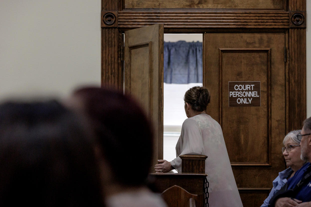 Image: Jana Bradford exits the courtroom after spotting the photographer. (Shelby Tauber for NBC News)