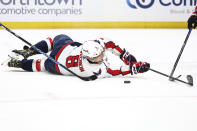 Washington Capitals left wing Alex Ovechkin (8) tries to make a pass from the ice during the second period of an NHL hockey game against the Buffalo Sabres Tuesday, April 2, 2024, in Buffalo, N.Y. (AP Photo/Jeffrey T. Barnes)