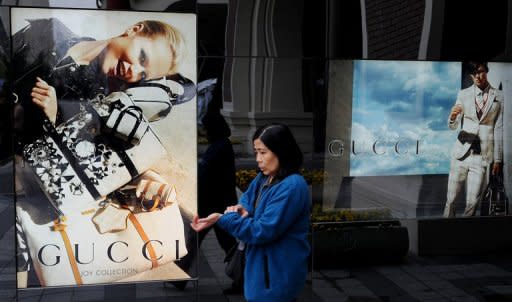 This file photo shows window display of a Gucci store in Shanghai. Italy's top designer brands are looking to China for salvation this year with revenues falling due to a debt crisis that has cast an air of gloom as Milan Fashion Week kicks off on Wednesday