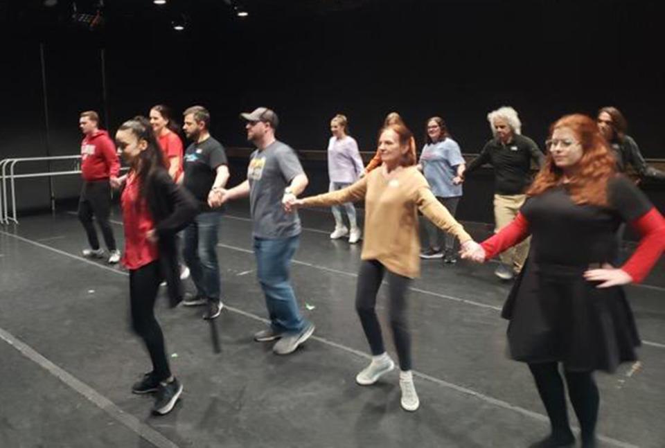 Rania Charalambidou leads guests in dancing the Podaraki during free Greek folk dancing classes at Montgomery Ballet.