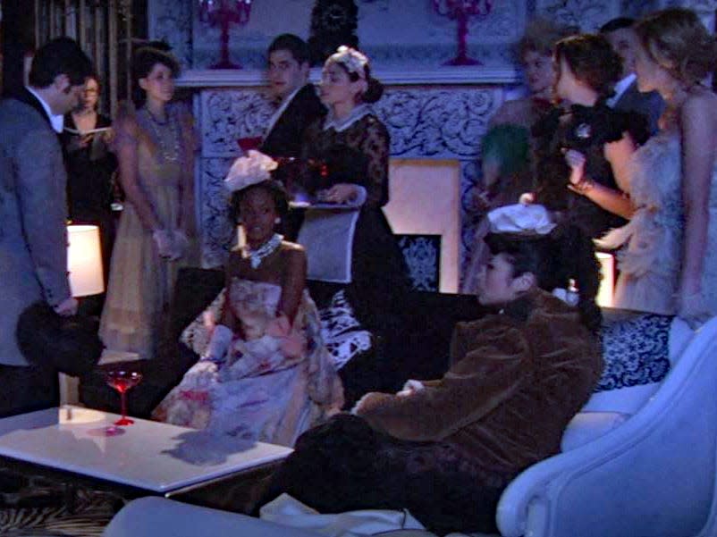 characters on stage performing a school play on gossip girl