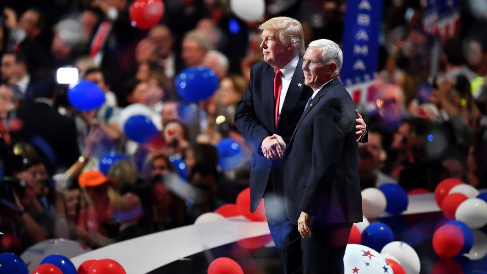 In this July 2016 photo, then-Republican presidential candidate Donald Trump and then-Republican vice presidential candidate Mike Pence acknowledge the crowd at the end of the Republican National Convention in Cleveland. - Jeff J Mitchell/Getty Images
