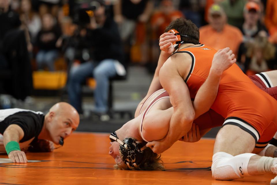 Oklahoma State 141-pounder Tagen Jamison pins OU's Carter Schmidt during Sunday's dual at Gallagher-Iba Arena in Stillwater.
