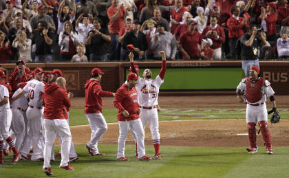 Cardinals players celebrate on the field after their 3-2 victory over the Dodgers on Tuesday. (AP)
