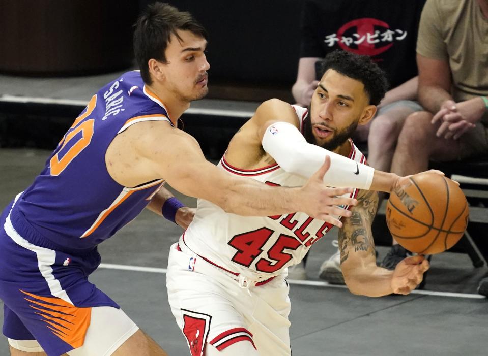 Mar 31, 2021; Phoenix, Arizona, USA; Phoenix Suns forward Dario Saric (20) pressures Chicago Bulls guard Denzel Valentine (45) in the second half at Phoenix Suns Arena. Mandatory Credit: Rob Schumacher-Arizona Republic