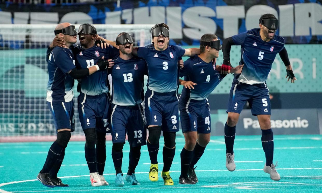 <span>France players celebrate after winning the shootout.</span><span>Photograph: Christophe Ena/AP</span>