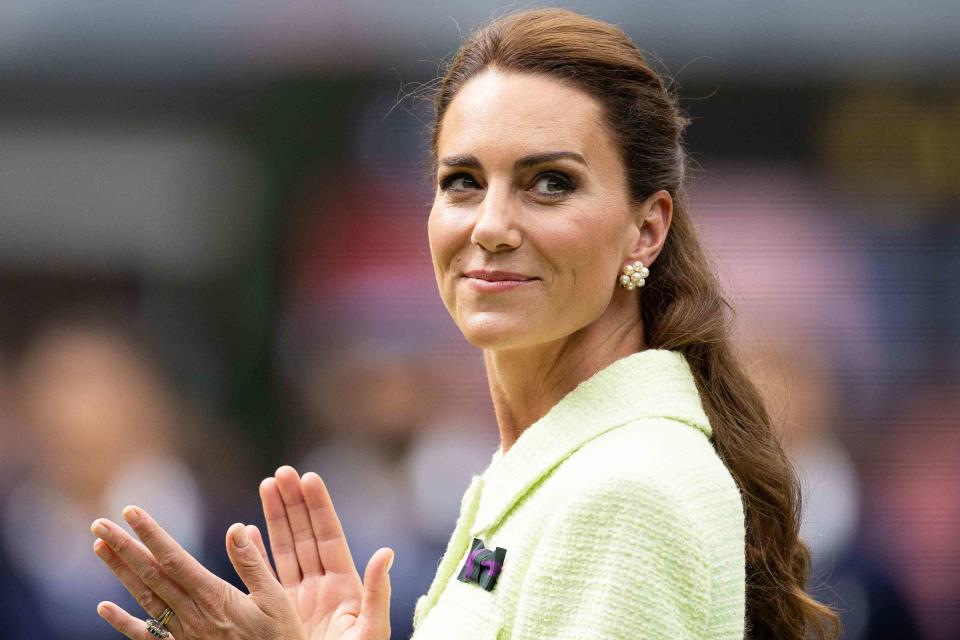 <p>Simon Bruty/Anychance/Getty </p> Kate Middleton smiles during the trophy ceremony for the Women