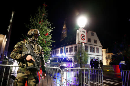 Soldier secures area where a suspect is sought after a shooting in Strasbourg, France, December 11, 2018. REUTERS/Christian Hartmann