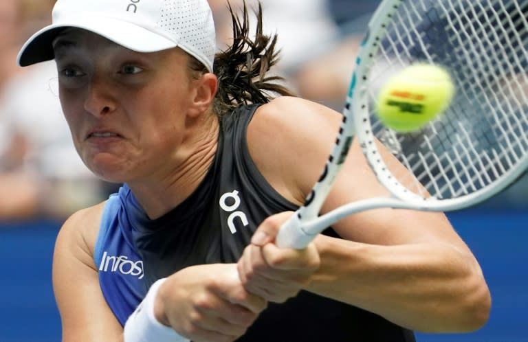 Poland's Iga Swiatek powered into the second round of the US Open with a straight sets victory against <a class="link " href="https://sports.yahoo.com/soccer/teams/sweden-women/" data-i13n="sec:content-canvas;subsec:anchor_text;elm:context_link" data-ylk="slk:Sweden;sec:content-canvas;subsec:anchor_text;elm:context_link;itc:0">Sweden</a>'s Rebecca Peterson (TIMOTHY A. CLARY)