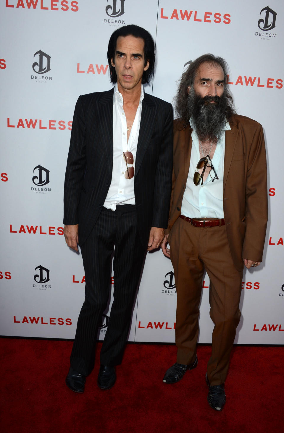 HOLLYWOOD, CA - AUGUST 22: Writer/Musician Nick Cave and musician Warren Ellis arrive at the Premiere of the Weinstein Company's "Lawless" at ArcLight Cinemas on August 22, 2012 in Hollywood, California. (Photo by Frazer Harrison/Getty Images)