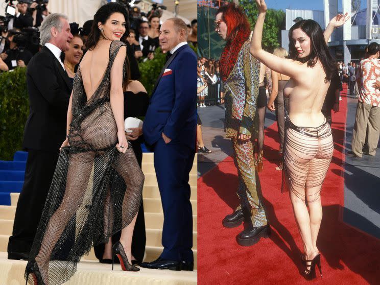 <p>In a sea of celebrities, Kendall Jenner made sure all eyes were on her at the 2017 Met Gala in a black sheer La Perla Haute Couture gown – reportedly made out of 85,000 hand-painted crystals! Jenner complemented the look with a thong, towering heels, flipped over shoulder-length tresses, neutral makeup and a bold lip. Yaasss, honey. The look was somewhat akin to what actress Rose McGowan donned at the 1998 MTV VMAs. Previously seen as one of the most daring red carpet looks of all time—and now the new norm for most celebs—McGowan nearly bared it all in a sheer, midi-length, backless shift dress. We could do a who wore it better—but tell us, is this too much sheer for your taste? <i> (Photo: Rex/Getty Images) </i> </p>