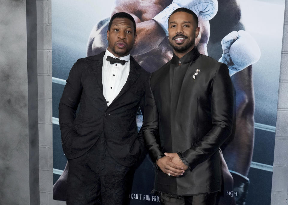 Jonathan Majors, left, and Michael B. Jordan arrive at the premiere of "Creed III" on Monday, Feb. 27, 2023, at TCL Chinese Theatre in Los Angeles. (Photo by Jordan Strauss/Invision/AP)