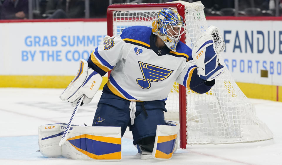 St. Louis Blues goaltender Jordan Binnington makes a glove save against the Colorado Avalanche in the second period of Game 1 of an NHL hockey Stanley Cup first-round playoff series Monday, May 17, 2021, in Denver. (AP Photo/David Zalubowski)