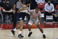 Ohio State's E.J. Liddell, right, posts up against Michigan's Isaiah Livers during the second half of an NCAA college basketball game Sunday, Feb. 21, 2021, in Columbus, Ohio. (AP Photo/Jay LaPrete)