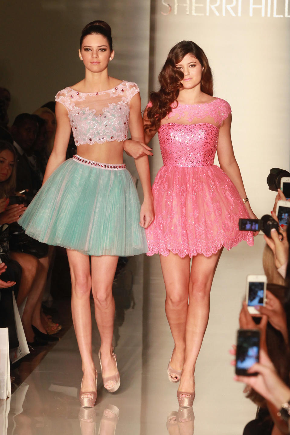 Kendall and Kylie Jenner walk the runway at the Evening Sherri Hill spring 2013 fashion show during Mercedes-Benz Fashion Week at Trump Tower Grand Corridor on September 7, 2012 in New York City.