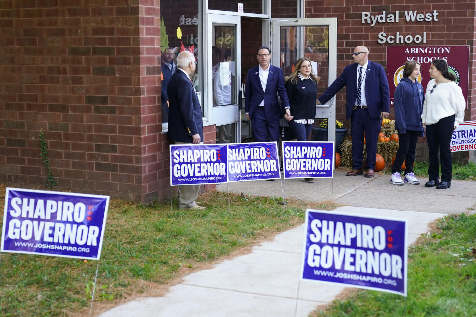 Pennsylvania gubernatorial candidate state Attorney General Josh Shapiro, accompanied by his Lori Shapiro, departs after casting his ballot in the midterm elections in Rydal , Pa., Tuesday, Nov. 8, 2022. (AP Photo/Matt Rourke)