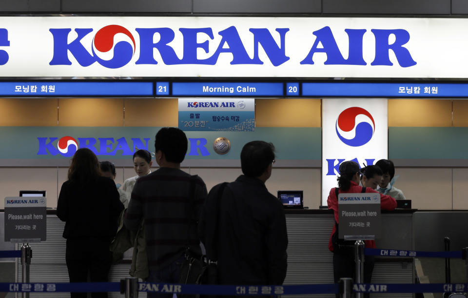 Passengers wait to buy tickets at a Korean Air ticketing counter at Gimpo airport in Seoul, South Korea, Thursday, Oct. 25, 2012. South Korea's flagship carrier Korean Air returned to profit after two straight quarters of losses as increased international passengers and a favorable exchange rate offset lower cargo shipments. (AP Photo/Lee Jin-man)