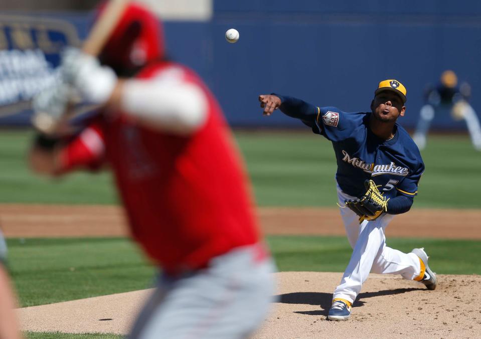 Milwaukee Brewers starting pitcher Freddy Peralta (51) throws in the first inning during a 2019 spring training game against the Los Angeles Angels at Maryvale Baseball Park.