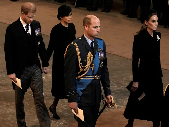 Prince Harry and Meghan Markle held hands at a service honoring the Queen on Wednesday.